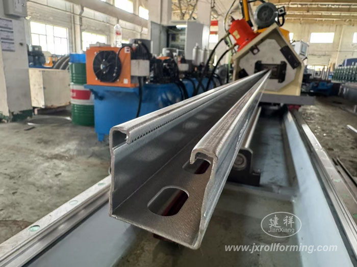 Fully Automatic Solar Strut Channel Roll Forming Machine with post hydraulic punch in successful test running for Indian customer. 